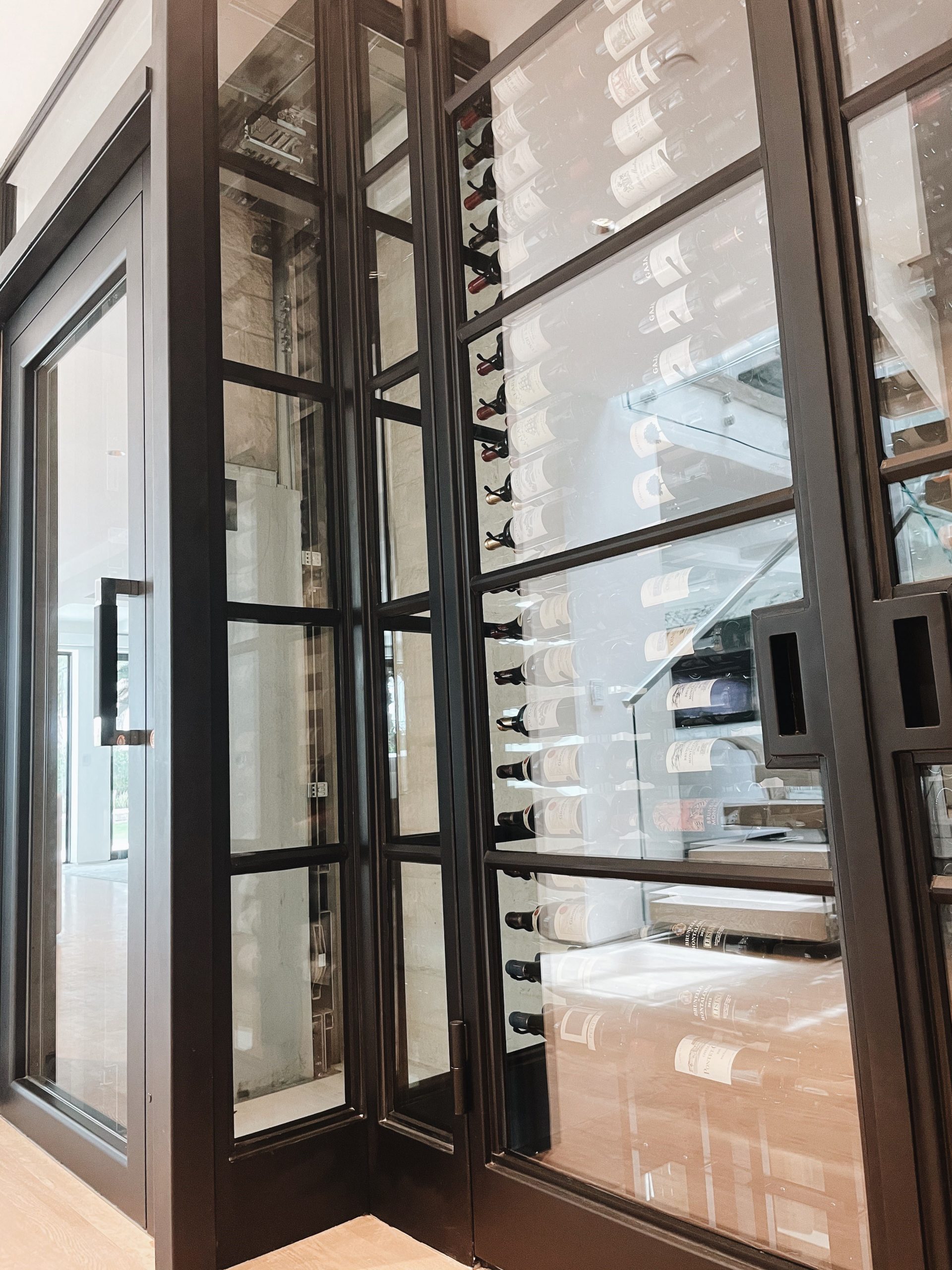 Elevator Boutique swing door home elevator with a Moderna cabin in Newport Beach