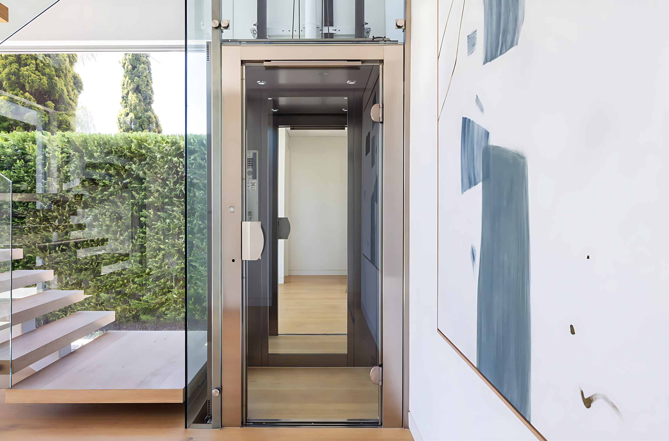 Elevator Boutique home elevator with a black swing door set into a timber batten wall