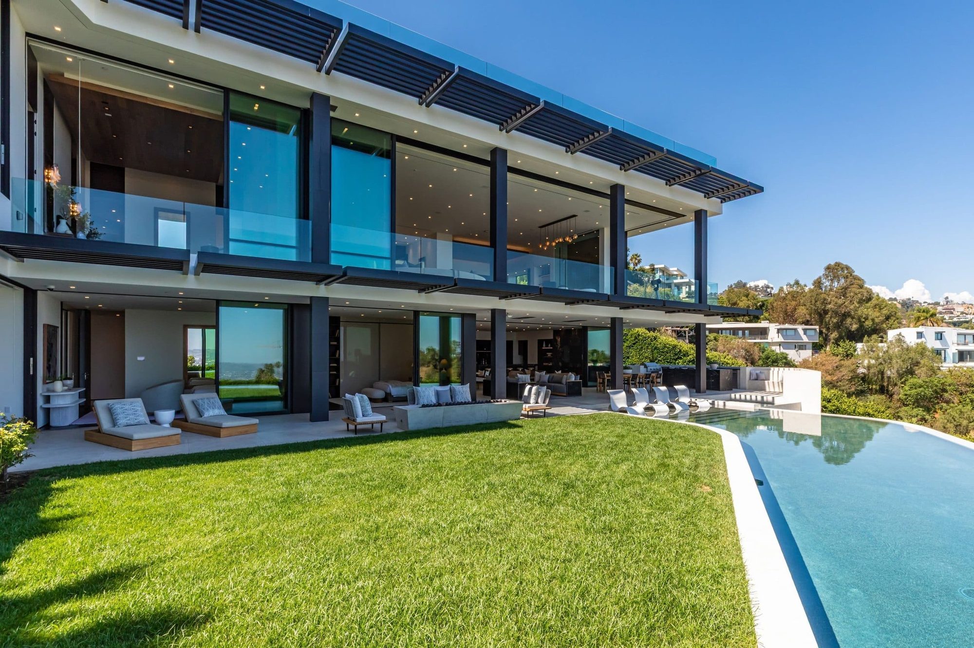Clad to Match, Beverly Hills Elevator Boutique 3-level home elevator with stainless doors and custom-clad cabin in a Beverly Hills mansion