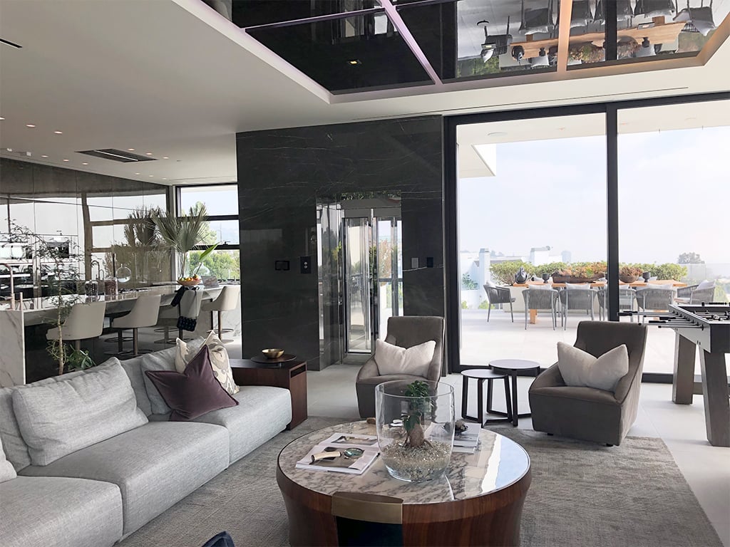 Framed glass automatic sliding door on an Elevator Boutique home elevator