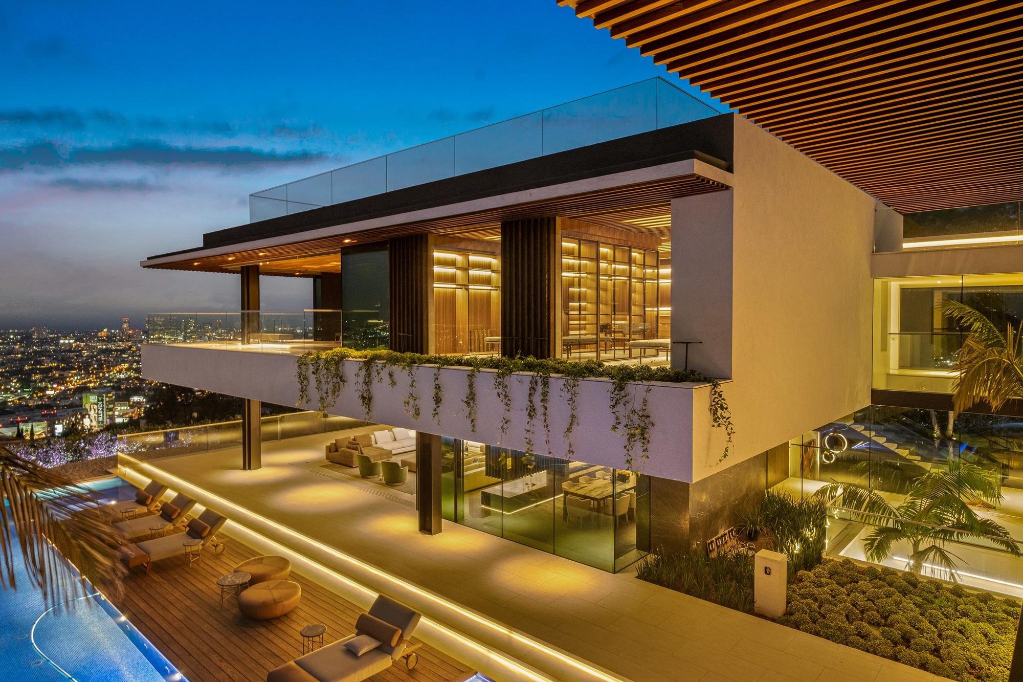 Hollywood Hills Showpiece Elevator Boutique 4-level home elevator with black glass doors in a contemporary Hollywood Hills home