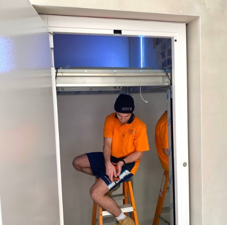 Elevator Boutique technician servicing a home elevator cabin