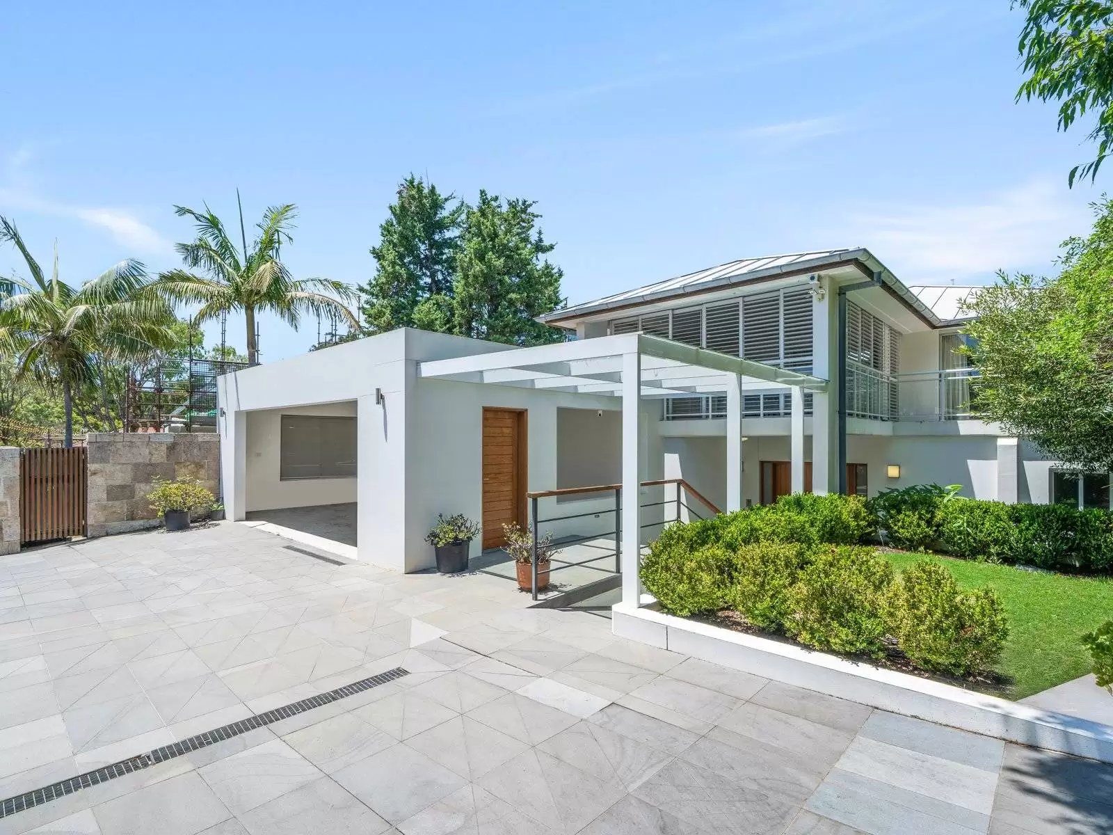 Watsons Bay Home Elevator Glass door home elevator opening onto the upstairs landing of a Watsons Bay home